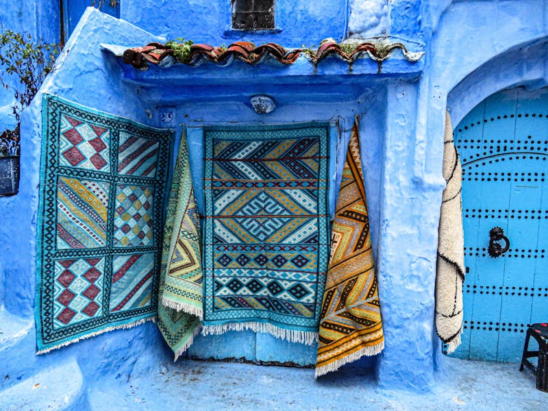 Handmade Moroccan Rugs Hanging in Chefchaouen